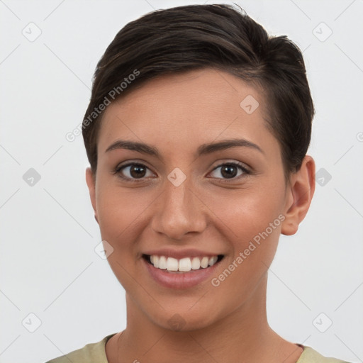 Joyful white young-adult female with short  brown hair and brown eyes