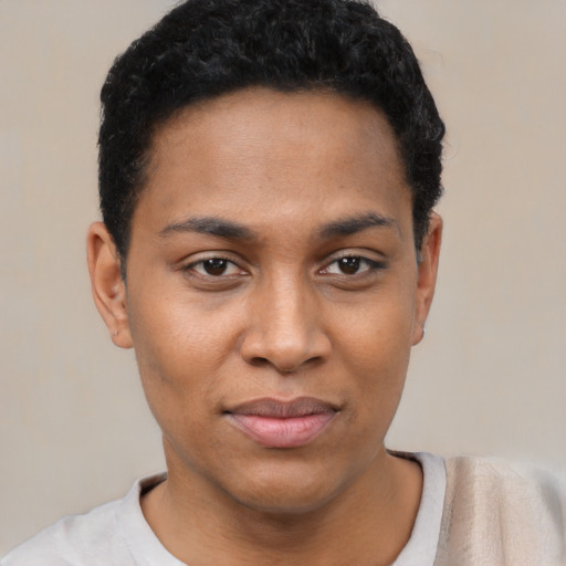 Joyful black young-adult female with short  black hair and brown eyes
