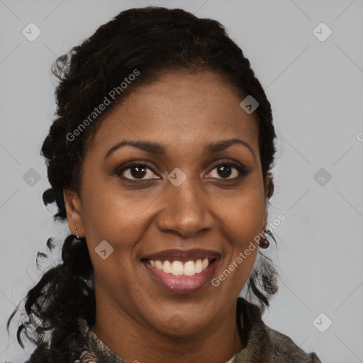 Joyful black adult female with short  brown hair and brown eyes