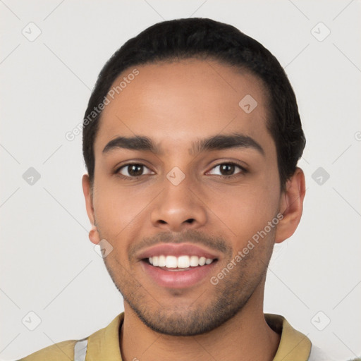 Joyful latino young-adult male with short  black hair and brown eyes