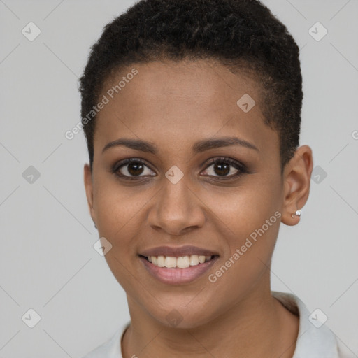 Joyful black young-adult female with short  brown hair and brown eyes