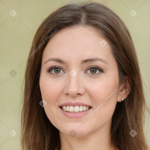 Joyful white young-adult female with long  brown hair and green eyes