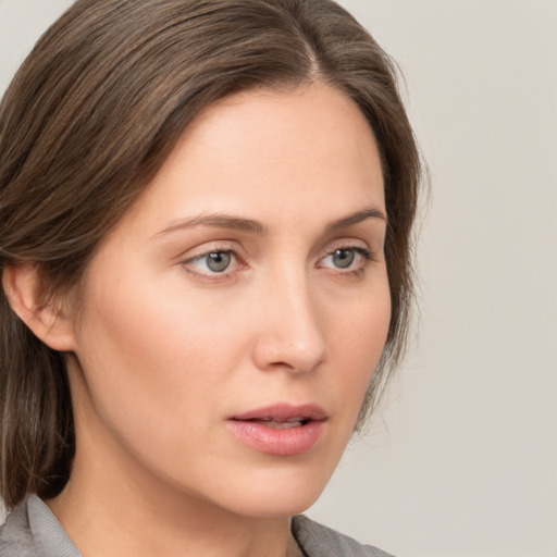 Neutral white young-adult female with medium  brown hair and grey eyes