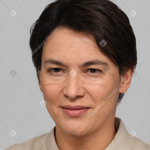 Joyful white adult female with short  brown hair and brown eyes