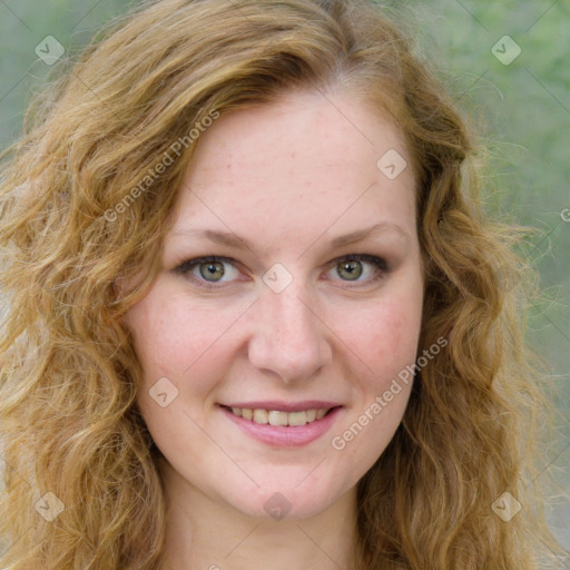 Joyful white young-adult female with long  brown hair and green eyes