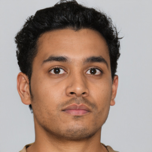 Neutral latino young-adult male with short  brown hair and brown eyes