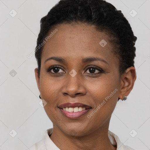 Joyful black young-adult female with short  brown hair and brown eyes