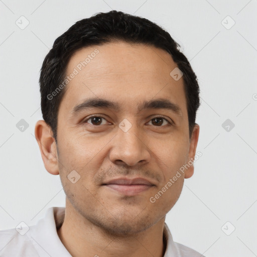 Joyful white young-adult male with short  black hair and brown eyes