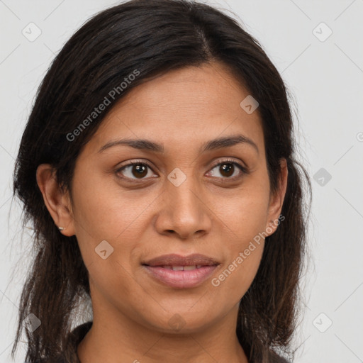 Joyful latino young-adult female with long  brown hair and brown eyes