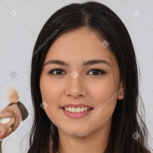 Joyful latino young-adult female with long  brown hair and brown eyes