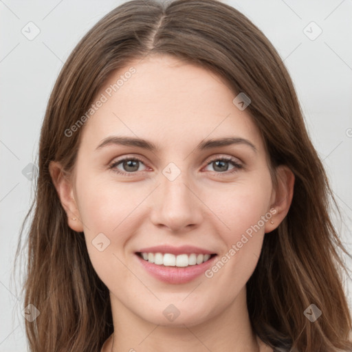 Joyful white young-adult female with long  brown hair and grey eyes