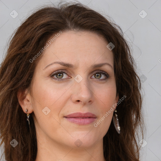 Joyful white adult female with long  brown hair and green eyes