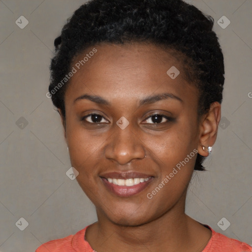 Joyful black young-adult female with short  black hair and brown eyes