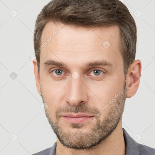 Neutral white young-adult male with short  brown hair and brown eyes