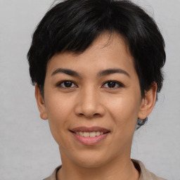 Joyful asian young-adult female with short  black hair and brown eyes