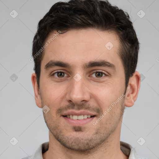 Joyful white young-adult male with short  brown hair and brown eyes