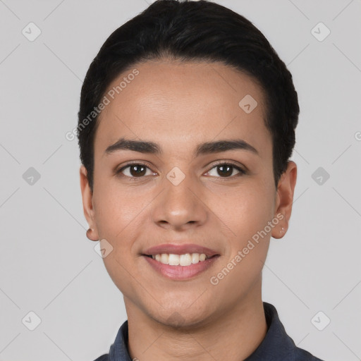 Joyful white young-adult male with short  black hair and brown eyes