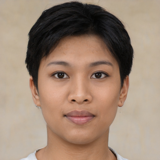 Joyful asian young-adult female with short  black hair and brown eyes
