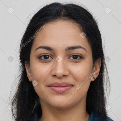 Joyful latino young-adult female with long  brown hair and brown eyes