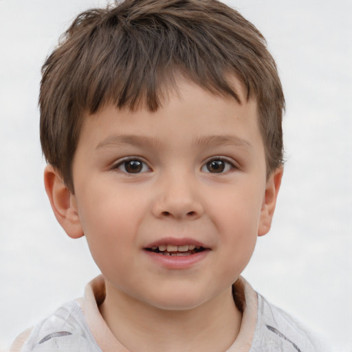 Joyful white child male with short  brown hair and brown eyes