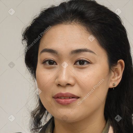 Joyful latino young-adult female with long  brown hair and brown eyes