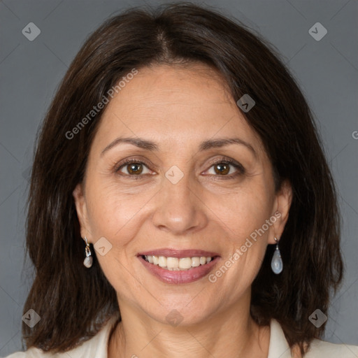 Joyful white adult female with medium  brown hair and brown eyes