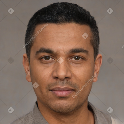 Neutral latino adult male with short  black hair and brown eyes