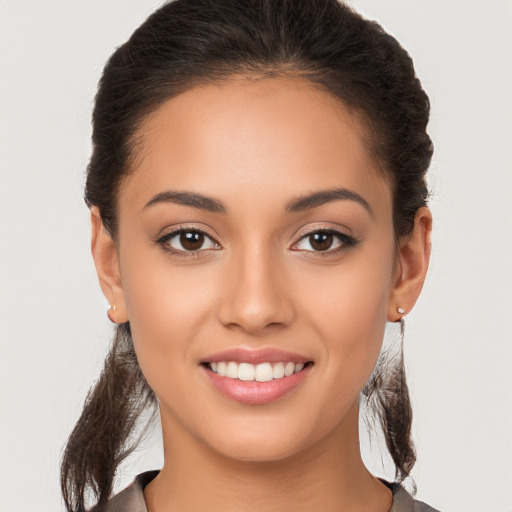 Joyful white young-adult female with long  brown hair and brown eyes