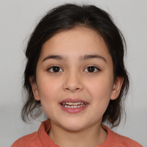 Joyful white child female with medium  brown hair and brown eyes