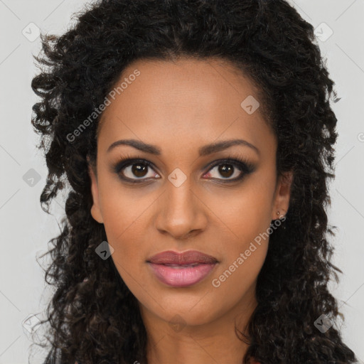 Joyful black young-adult female with long  brown hair and brown eyes