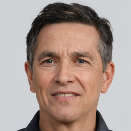 Joyful white middle-aged male with short  brown hair and brown eyes