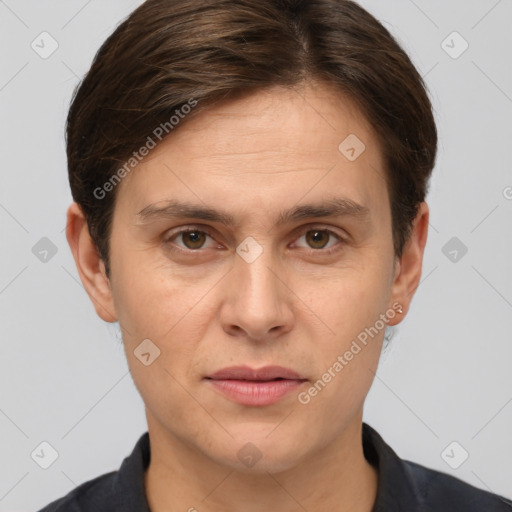 Joyful white adult male with short  brown hair and grey eyes