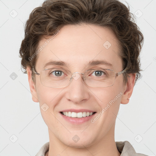 Joyful white adult female with short  brown hair and grey eyes