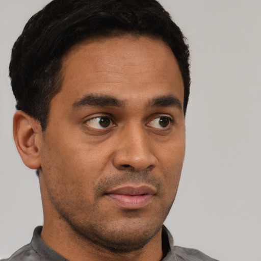 Neutral black young-adult male with short  brown hair and brown eyes