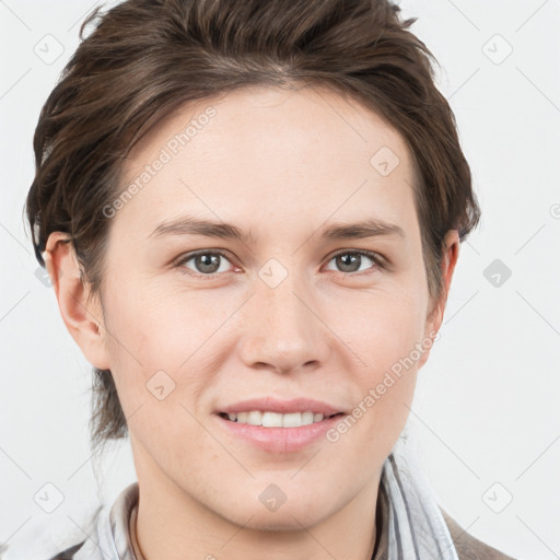 Joyful white young-adult female with short  brown hair and grey eyes