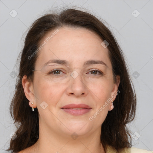 Joyful white adult female with medium  brown hair and brown eyes