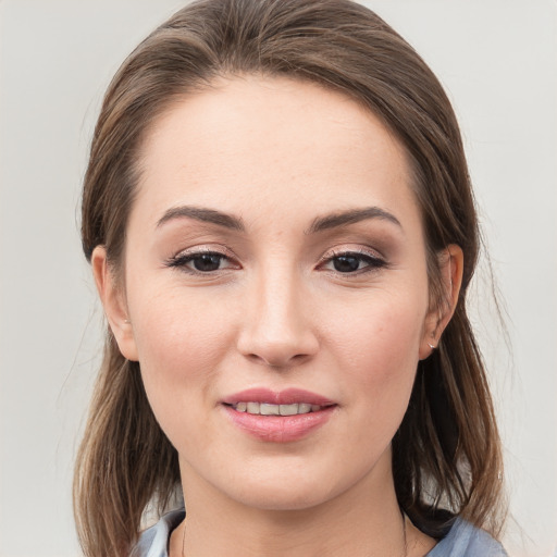 Joyful white young-adult female with medium  brown hair and grey eyes