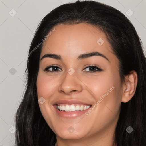 Joyful latino young-adult female with long  brown hair and brown eyes