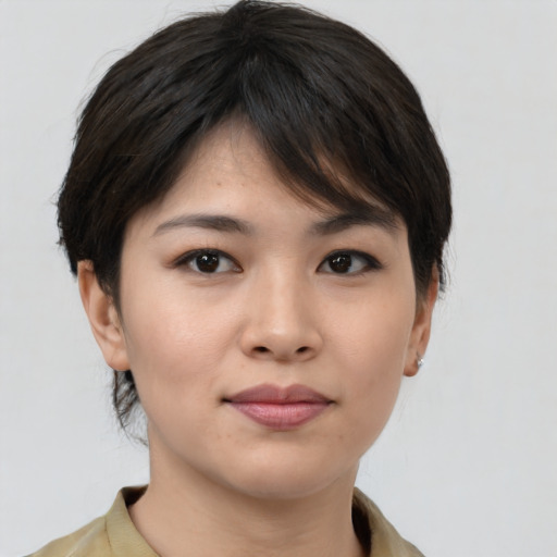 Joyful asian young-adult female with medium  brown hair and brown eyes