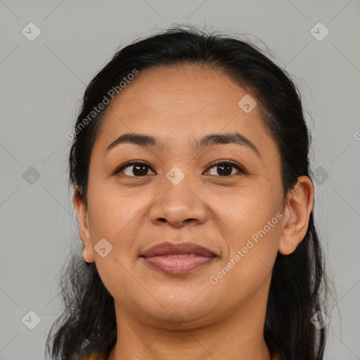 Joyful latino young-adult female with medium  brown hair and brown eyes