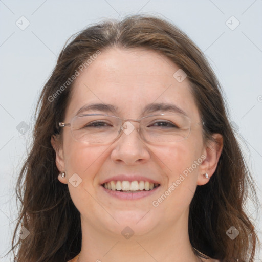 Joyful white adult female with long  brown hair and grey eyes