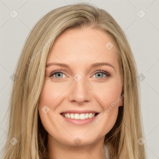 Joyful white young-adult female with long  brown hair and green eyes