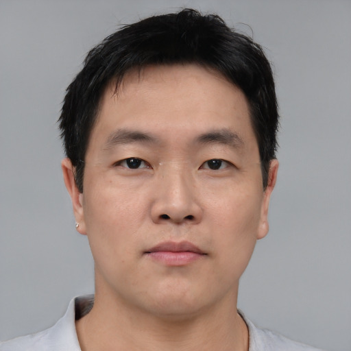 Neutral asian young-adult male with short  brown hair and brown eyes