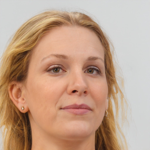 Joyful white adult female with long  brown hair and brown eyes