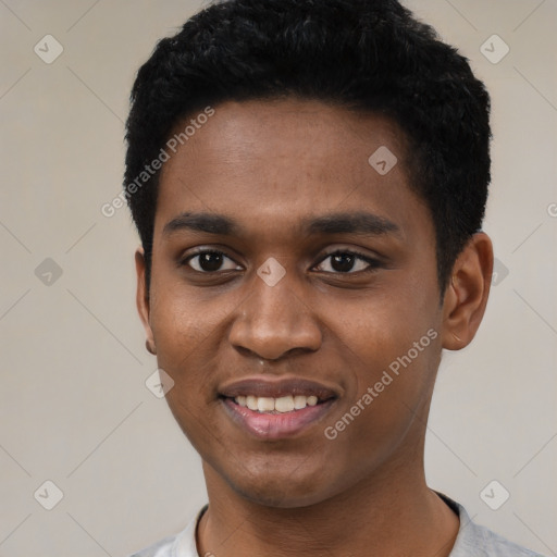 Joyful black young-adult male with short  black hair and brown eyes