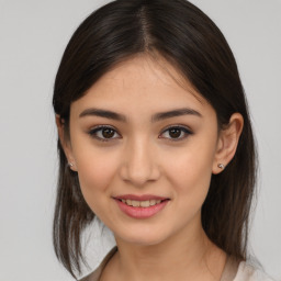 Joyful asian young-adult female with medium  brown hair and brown eyes