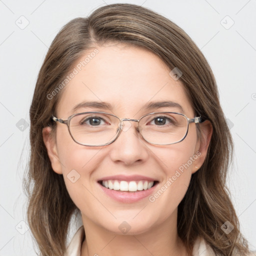 Joyful white young-adult female with long  brown hair and blue eyes