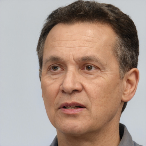 Joyful white middle-aged male with short  brown hair and brown eyes