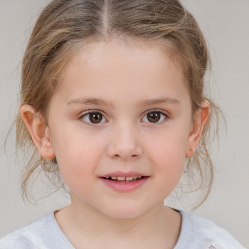 Joyful white child female with medium  brown hair and brown eyes