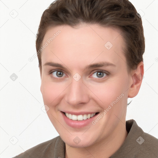 Joyful white young-adult female with short  brown hair and grey eyes